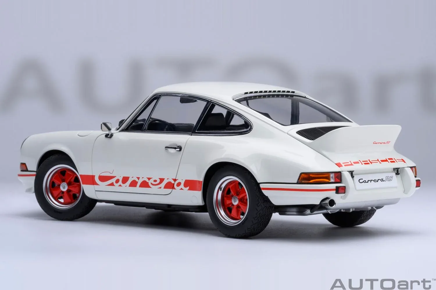 Autoart 1/18 Porsche 911 Carrera 2.7 RS Model in Grand Prix White with Red Stripes - Image 2